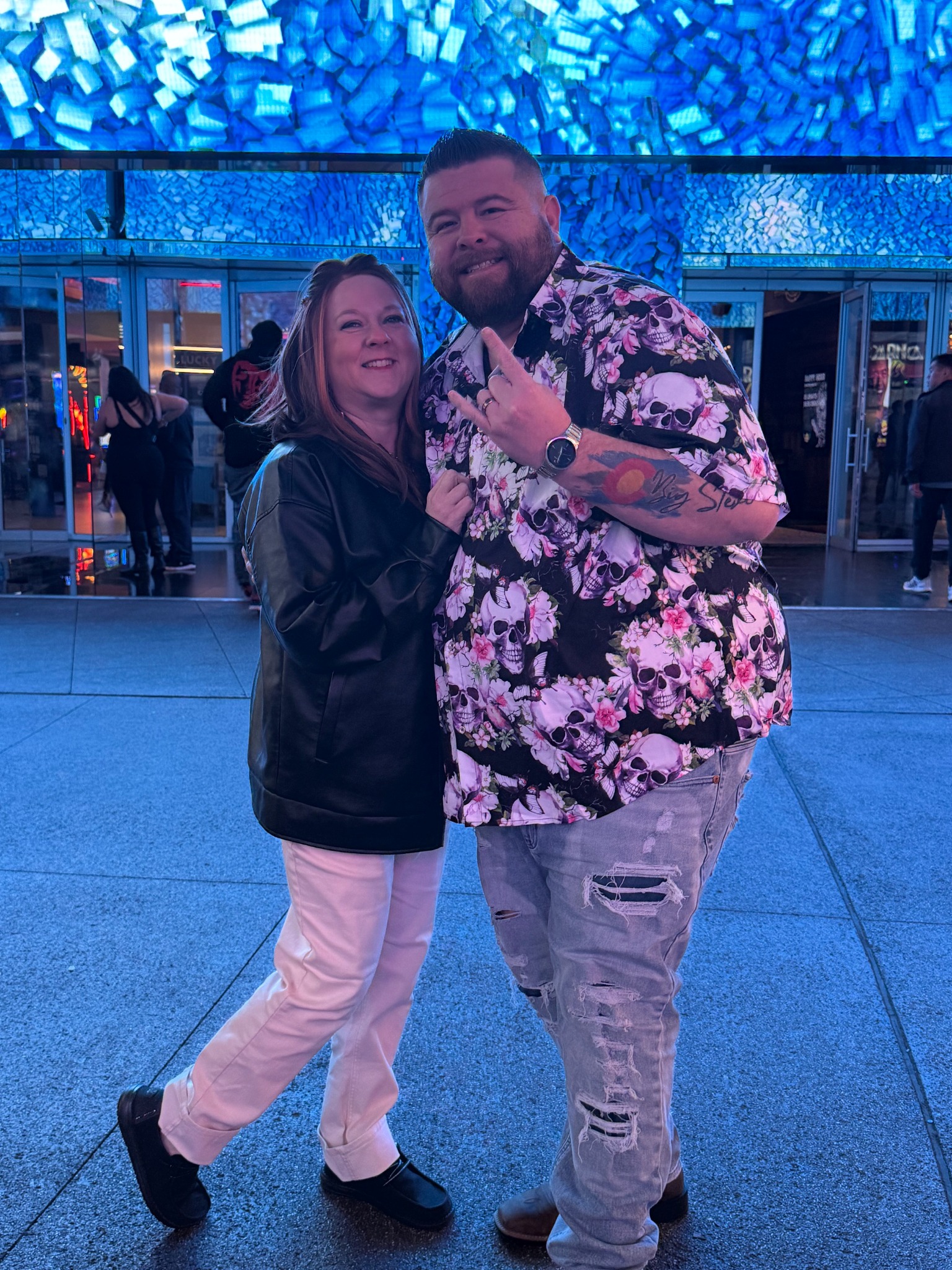 Big Steve and Krystal together against a blue background