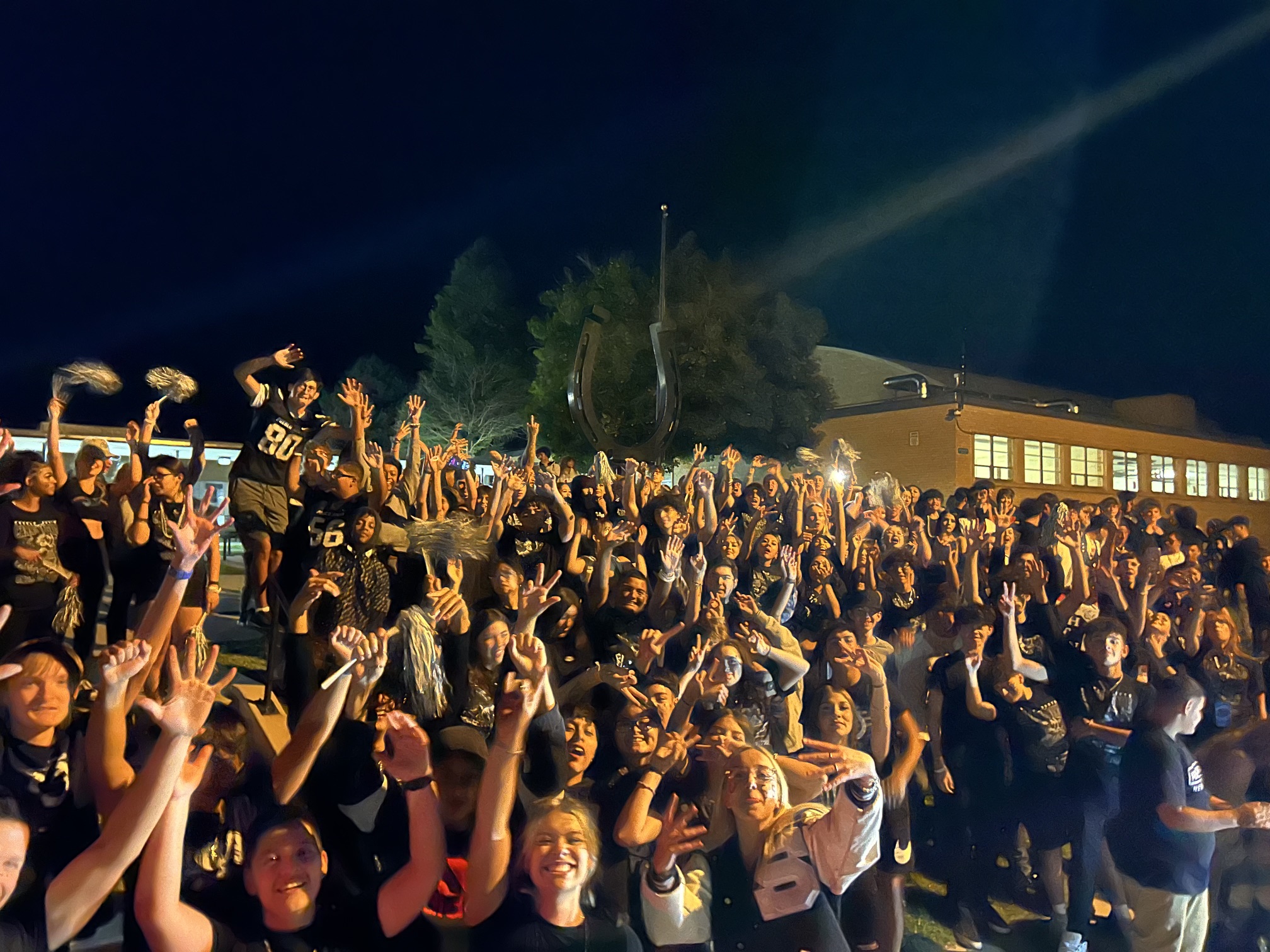 A lively nighttime crowd celebrating together
