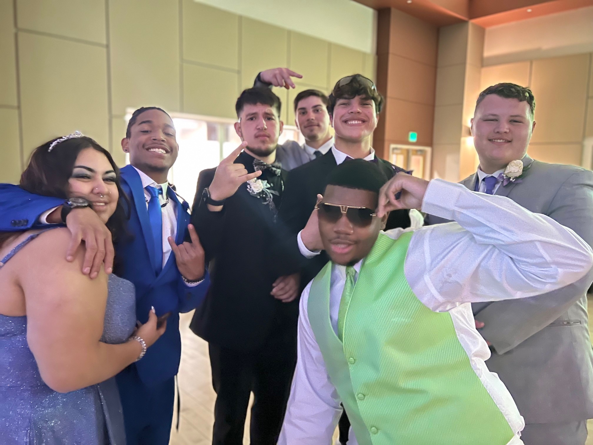 Students celebrating together at a formal dance
